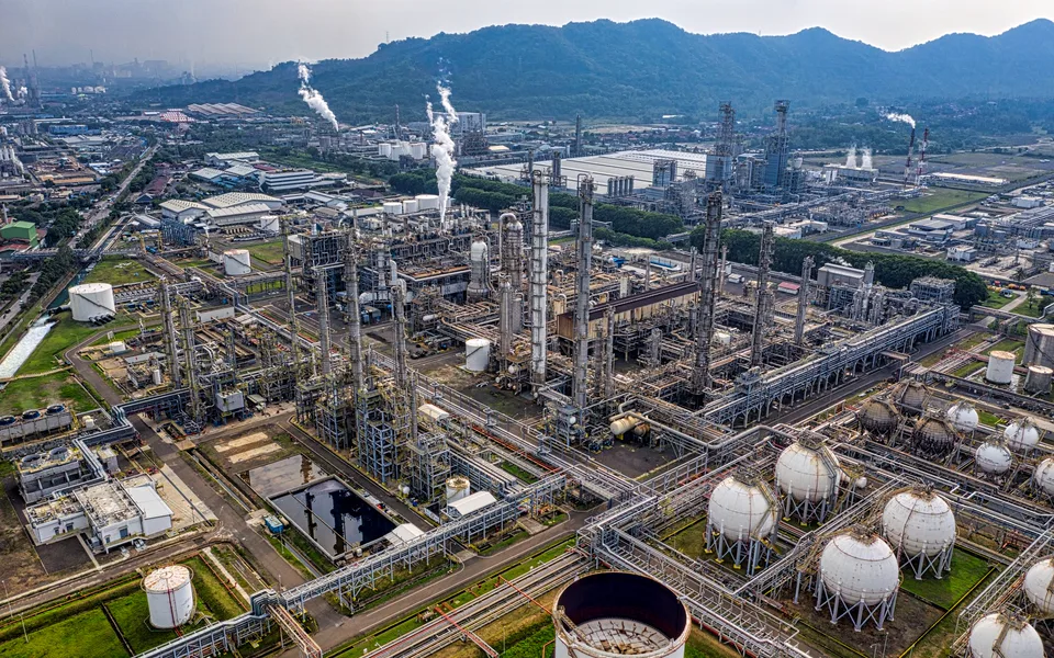 Aerial view across a large modern petrochemical refinery complex