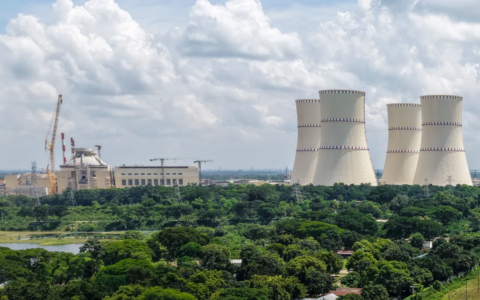 Large nuclear power plant with reactor buildings and cooling towers